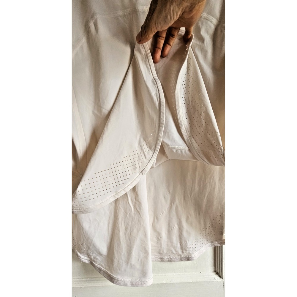 Lululemon woman off white short sleeve high side slits top sz 10 laser cut hem - Picture 6 of 6